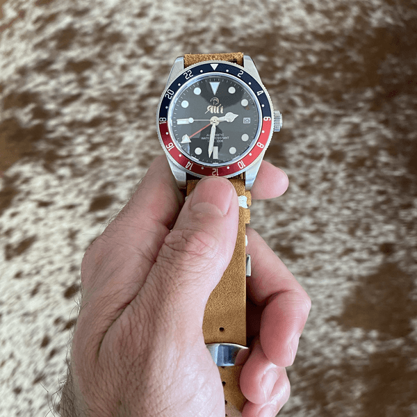 The Ali’i Watch Company Voyager GMT watch with a blue and red bezel.