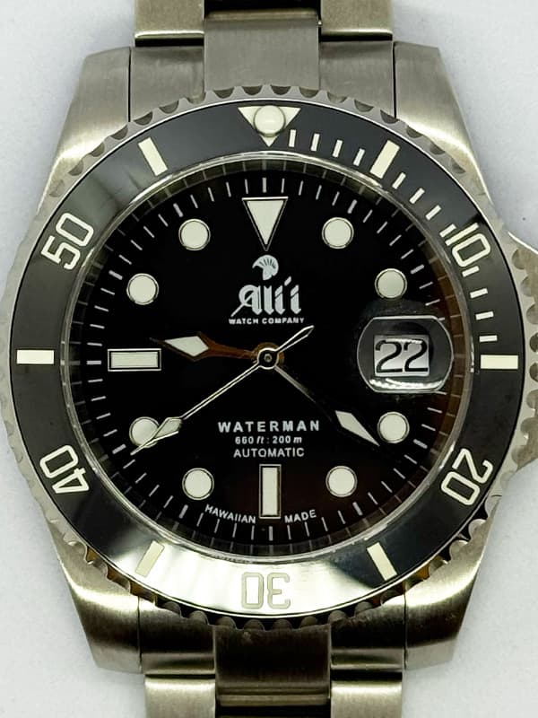 A detailed image of the dial on a Waterman 41MM Black Dial Black Bezel Sports Watch.