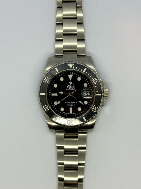 Front view of the Ali'i Watch Company Waterman dive watch with black dial and black bezel.