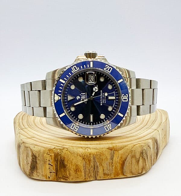 Waterman 41MM Blue Dial Blue Bezel Sports Watch sits on a piece of wood